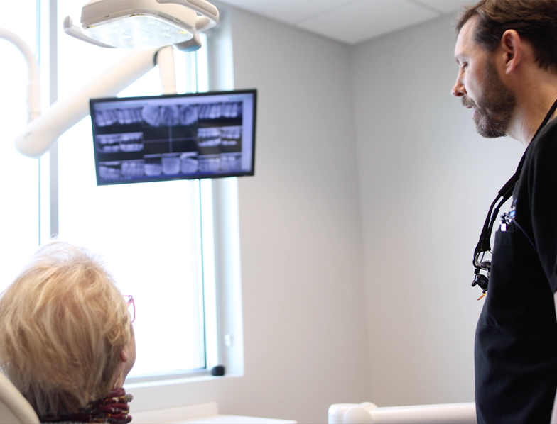 Atlanta dentist showing a patient their digital dental x rays