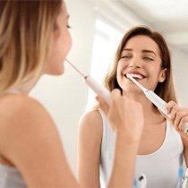 Woman brushing her teeth