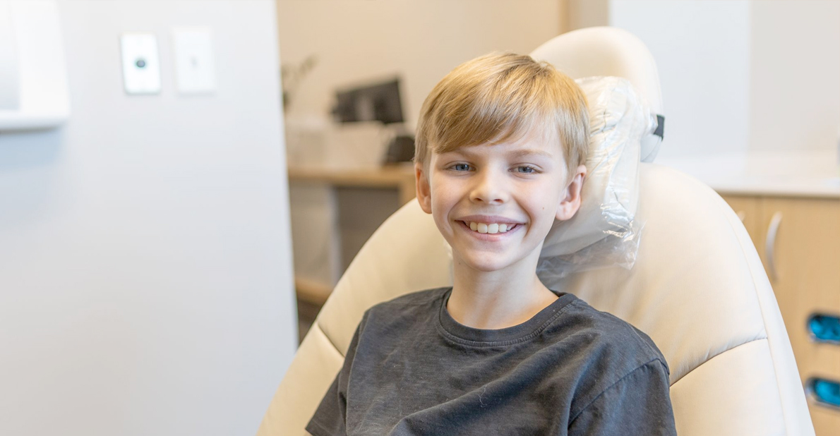 Young boy smiling while visiting children's dentist in Atlanta