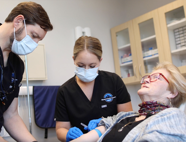 Dentist giving a patient an injection