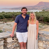 Doctor Matt with his wife with beach in background