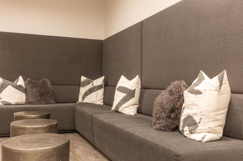 Pillows on long gray couch